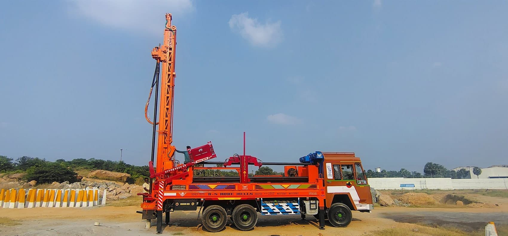 Velson Model-II truck-mounted automated water-well rig with tilted mast